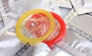 Can AIDS be avoided if we use condoms or contraceptive sheath?