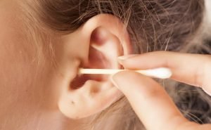 It is right to take out the wax from my ears as I think I am having some hearing problem?