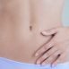 My friend gets a discharge sometimes from her navel. What is the problem?