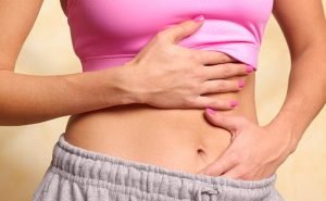 My friend suffers from PMS whereas I don't What is the reason?
