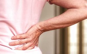 Why does backache take place?